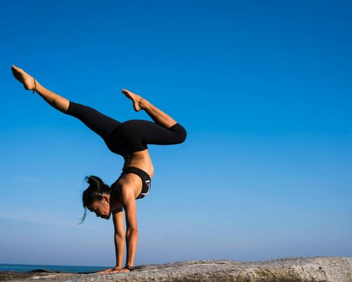 Person in a calm yoga pose, demonstrating flexibility.